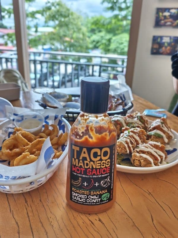 Mas Light's photo of a Taco Madness hot sauce bottle on the table